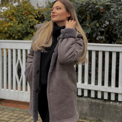 Mid length reversible faux shearling coat